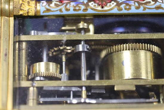 An early 20th century French ormolu and champleve enamel repeating carriage clock with alarm, 4.5in.